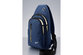 Blue sling bag with a Nike logo on a gray background