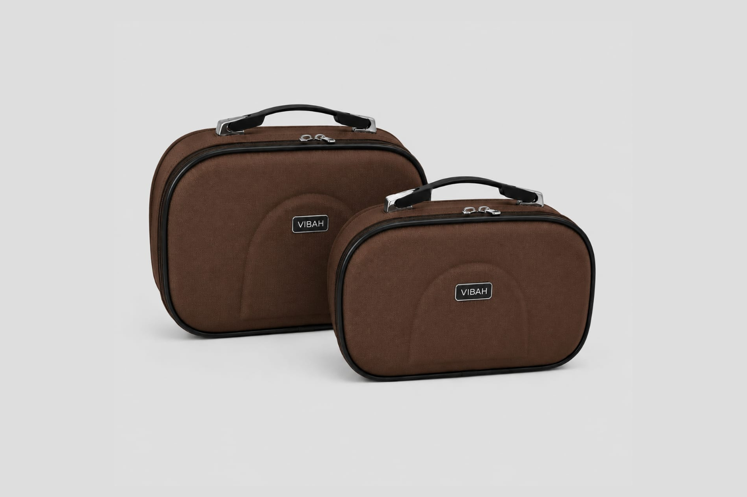Two brown travel cases with visible 'Vibah' branding on a light gray background