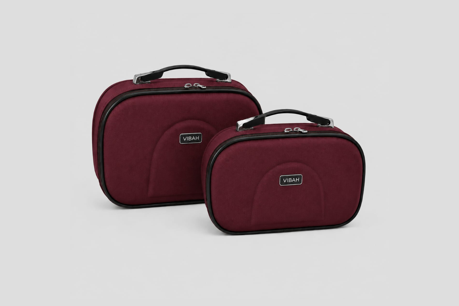 Two red travel cases with 'Vibram' branding on a light gray background